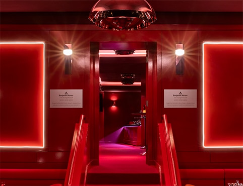 Benjamin Moore’s red-painted hospitality lounge at Madison Square Garden with red lighting. Benjamin Moore’s red-painted hospitality lounge at Madison Square Garden with red lighting.